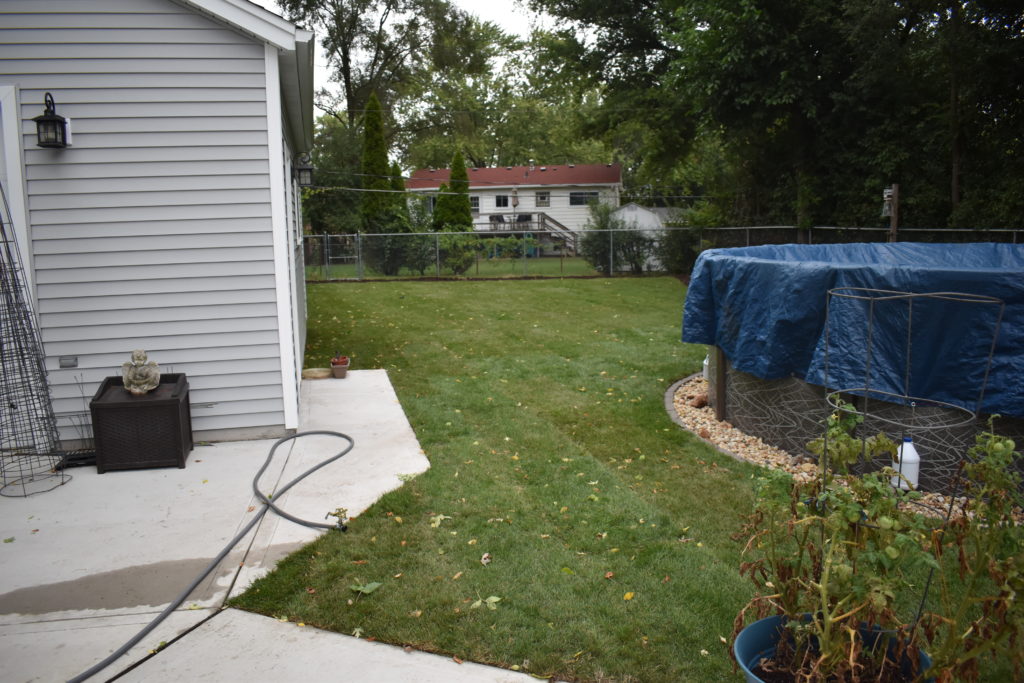 Same backyard after wall-to-wall new sod installation