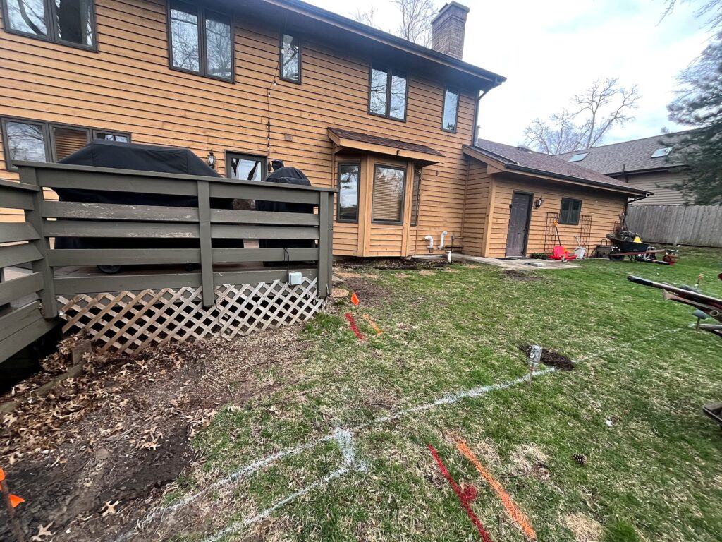 A new patio plan painted right on the lawn before the first shovel